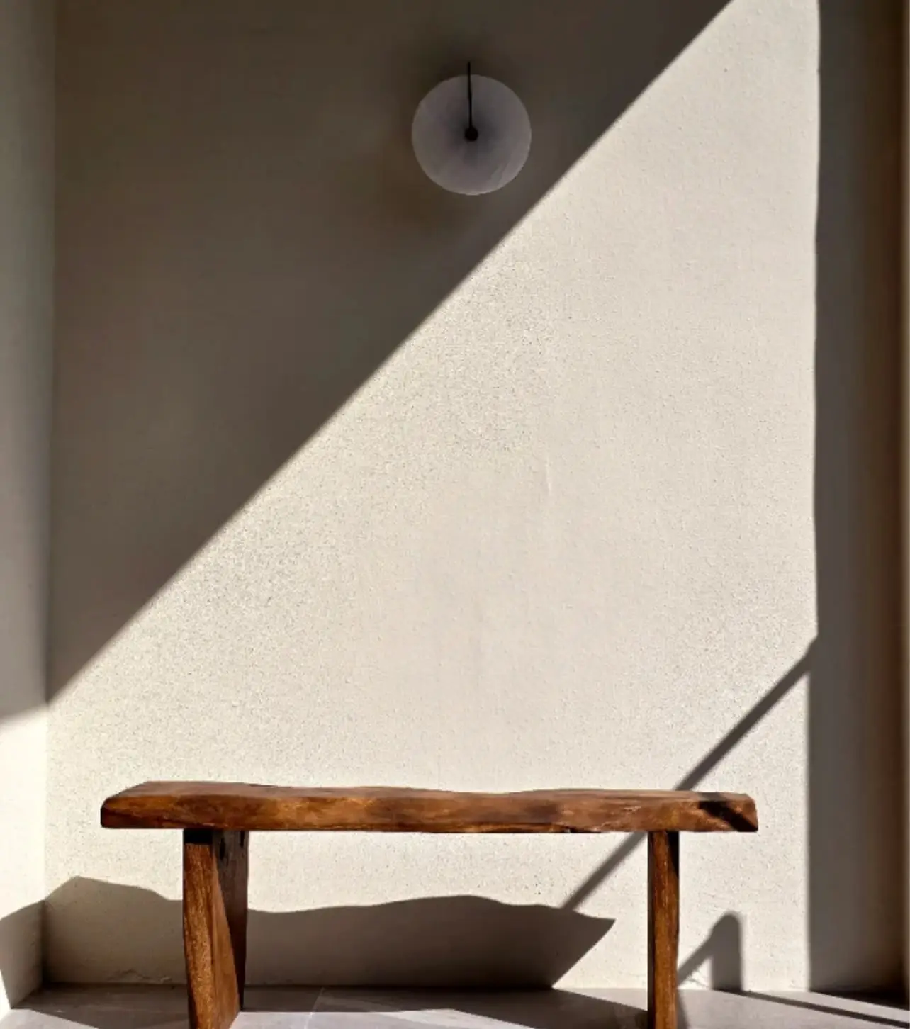 Wooden bench in the sunlight