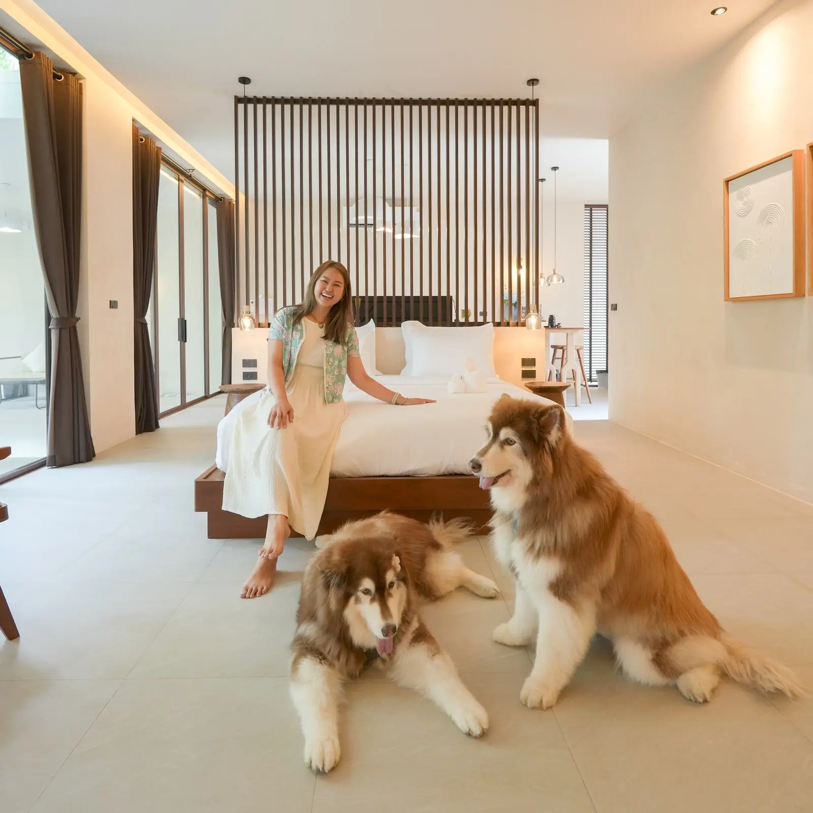 A guest with two large dogs in the bedroom