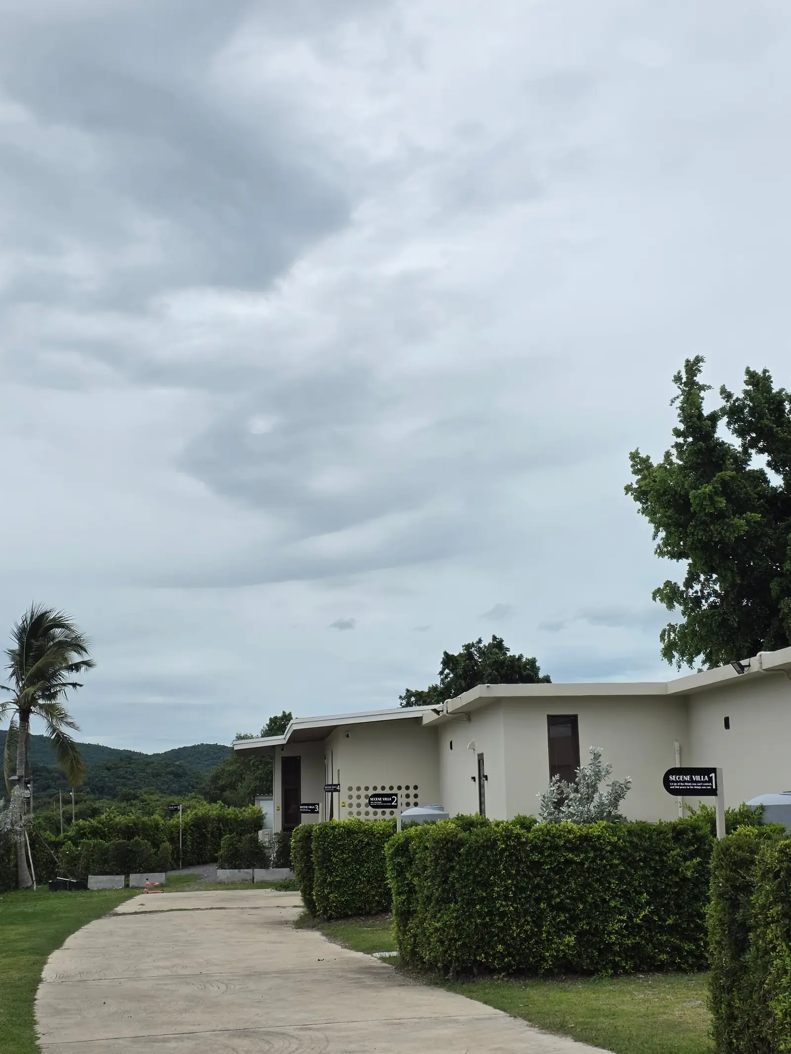 The driveway and parking behind the villas